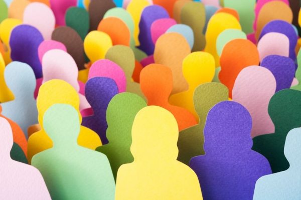 Lots of multicolored men and women silhouettes made with paper for crowd concept